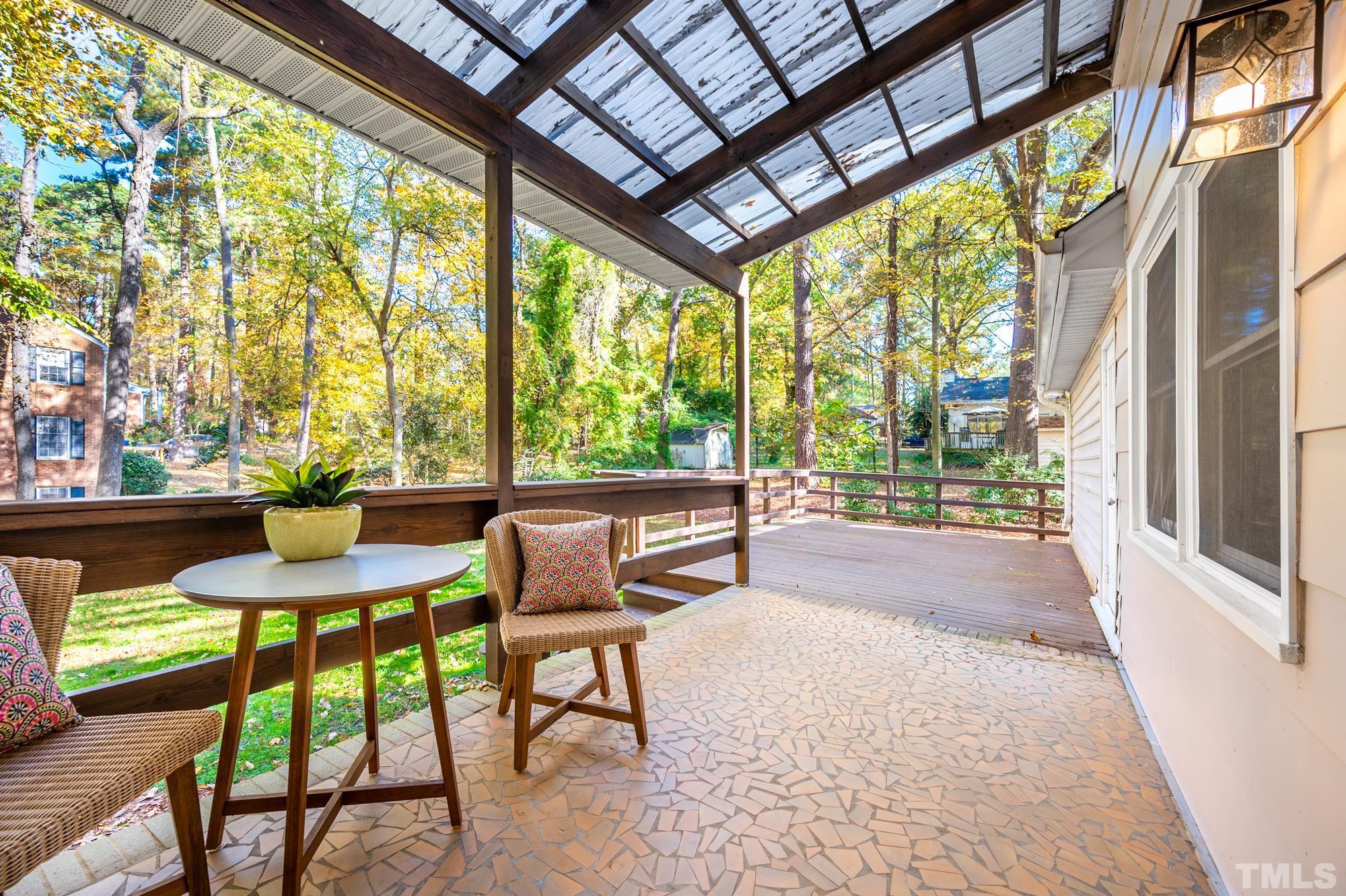 2910 Buckingham Road Durham, NC 27707 - Photo 26 of 30 a balcony with chairs and a table