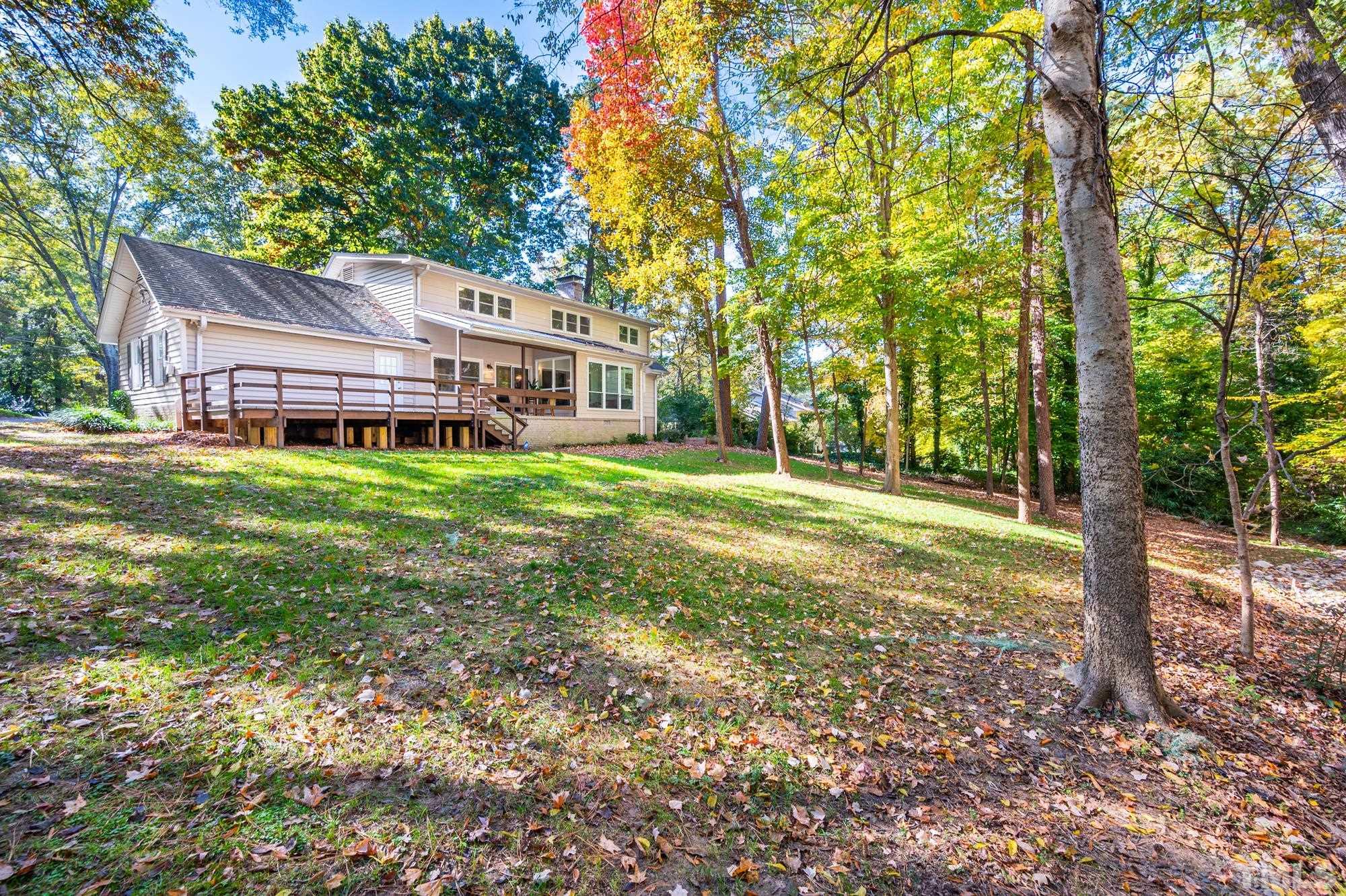2910 Buckingham Road Durham, NC 27707 - Photo 29 of 30 a backyard of a house with table and chairs