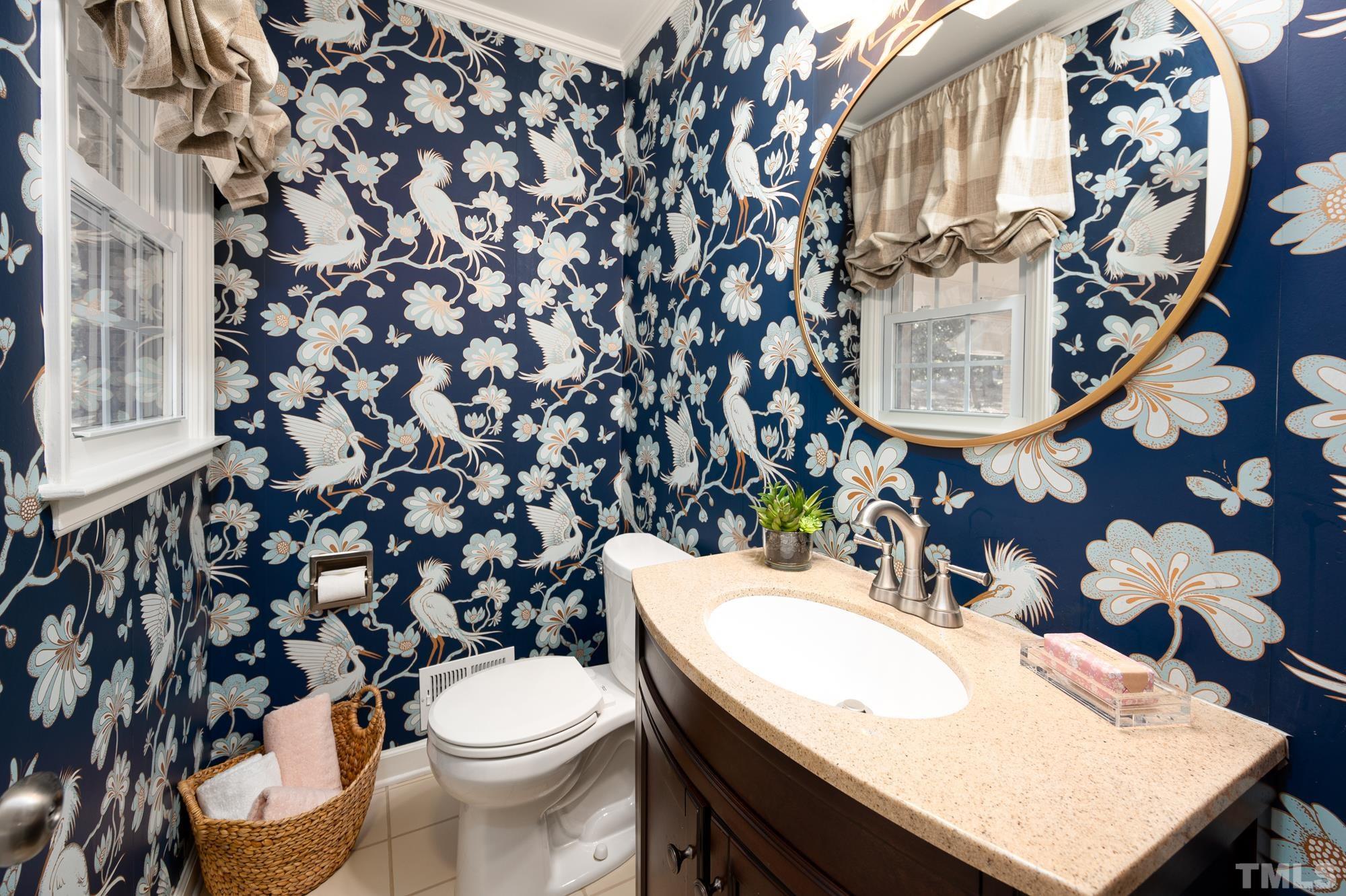 2910 Buckingham Road Durham, NC 27707 - Photo 4 of 30 a bathroom with a sink toilet and a mirror