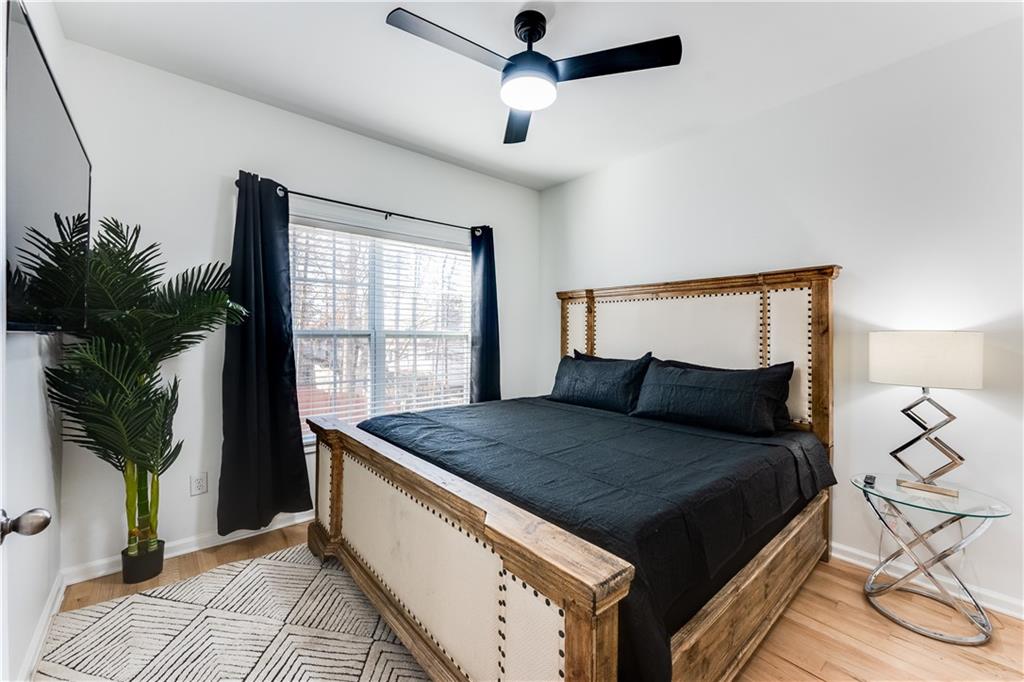 3135 Esplanade Circle Southwest Atlanta, GA 30311 - Photo 13 of 69 a bedroom with a bed and a potted plant on the dresser