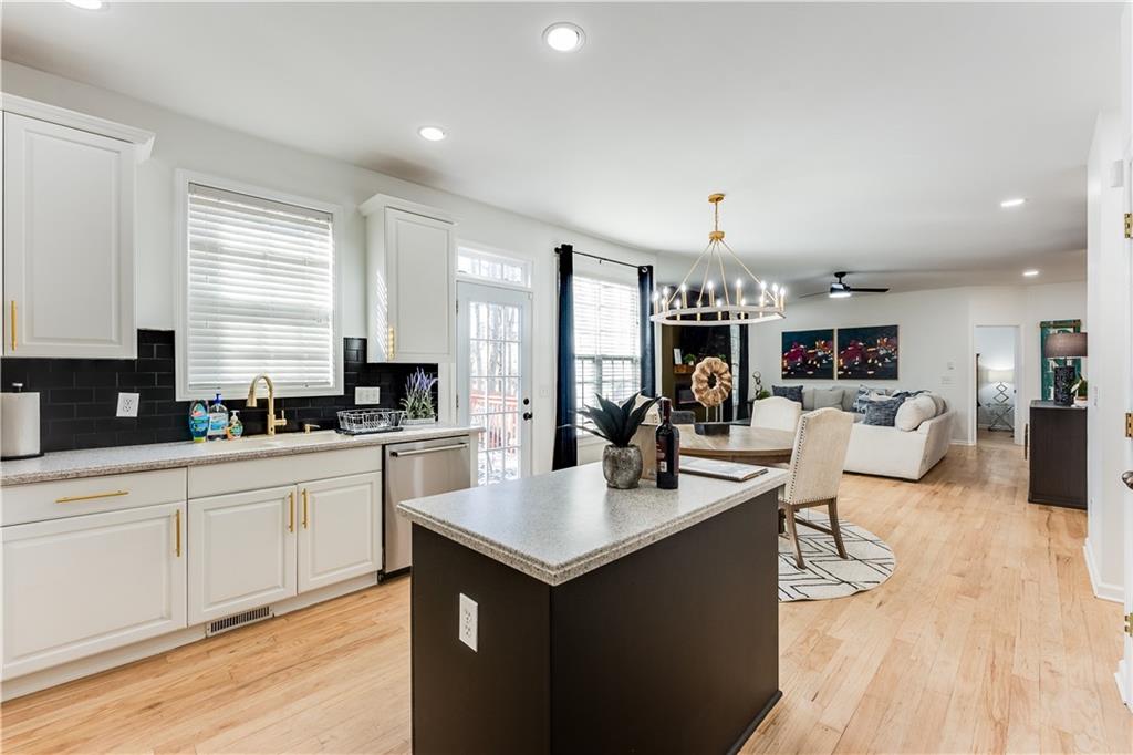 3135 Esplanade Circle Southwest Atlanta, GA 30311 - Photo 23 of 69 a large kitchen with kitchen island a sink a counter top space and stainless steel appliances
