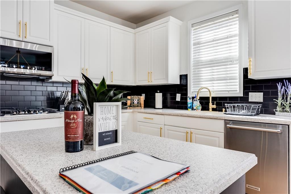 3135 Esplanade Circle Southwest Atlanta, GA 30311 - Photo 25 of 69 a kitchen with white cabinets and a sink