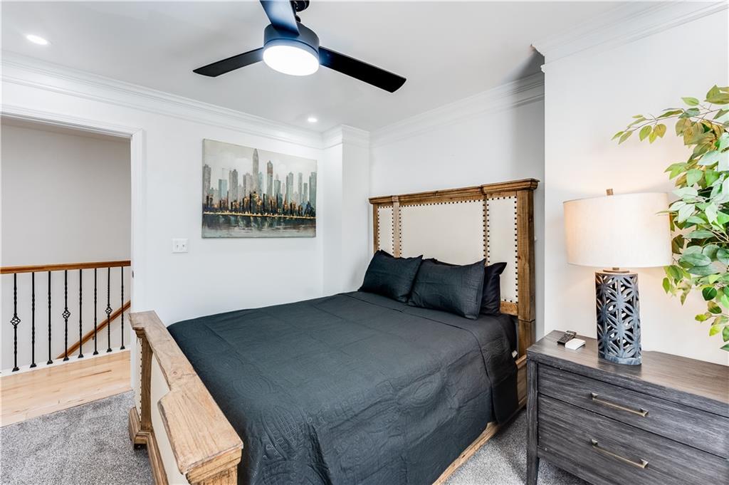 3135 Esplanade Circle Southwest Atlanta, GA 30311 - Photo 29 of 69 a bedroom with a bed and a painting on the wall