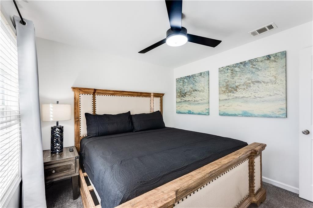 3135 Esplanade Circle Southwest Atlanta, GA 30311 - Photo 34 of 69 a bedroom with a bed and a painting on the wall