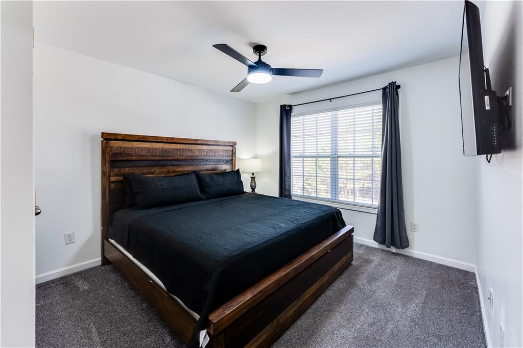 3135 Esplanade Circle Southwest Atlanta, GA 30311 - Photo 37 of 69 a bed sitting in a bedroom next to a window