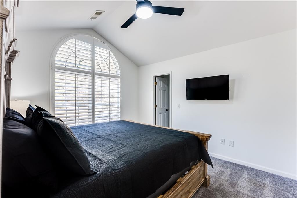 3135 Esplanade Circle Southwest Atlanta, GA 30311 - Photo 41 of 69 a bedroom with a bed and a flat screen tv