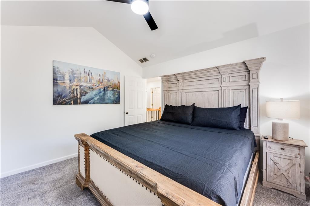 3135 Esplanade Circle Southwest Atlanta, GA 30311 - Photo 43 of 69 a large bed sitting in a bedroom next to a lamp