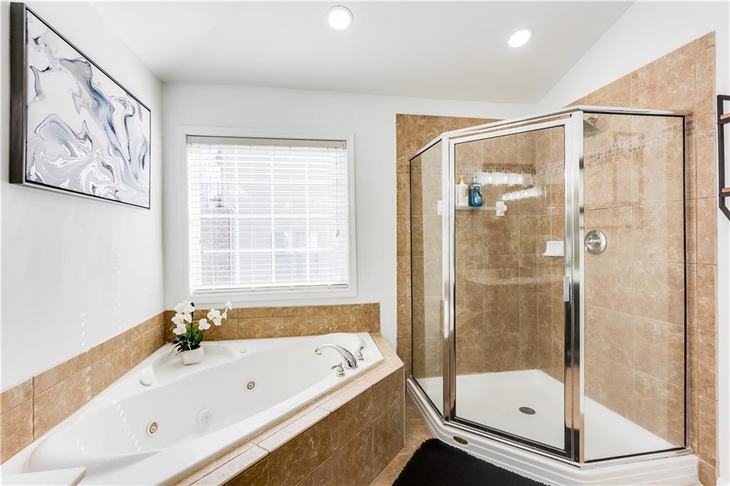 3135 Esplanade Circle Southwest Atlanta, GA 30311 - Photo 50 of 69 a bathroom with a bathtub and a shower