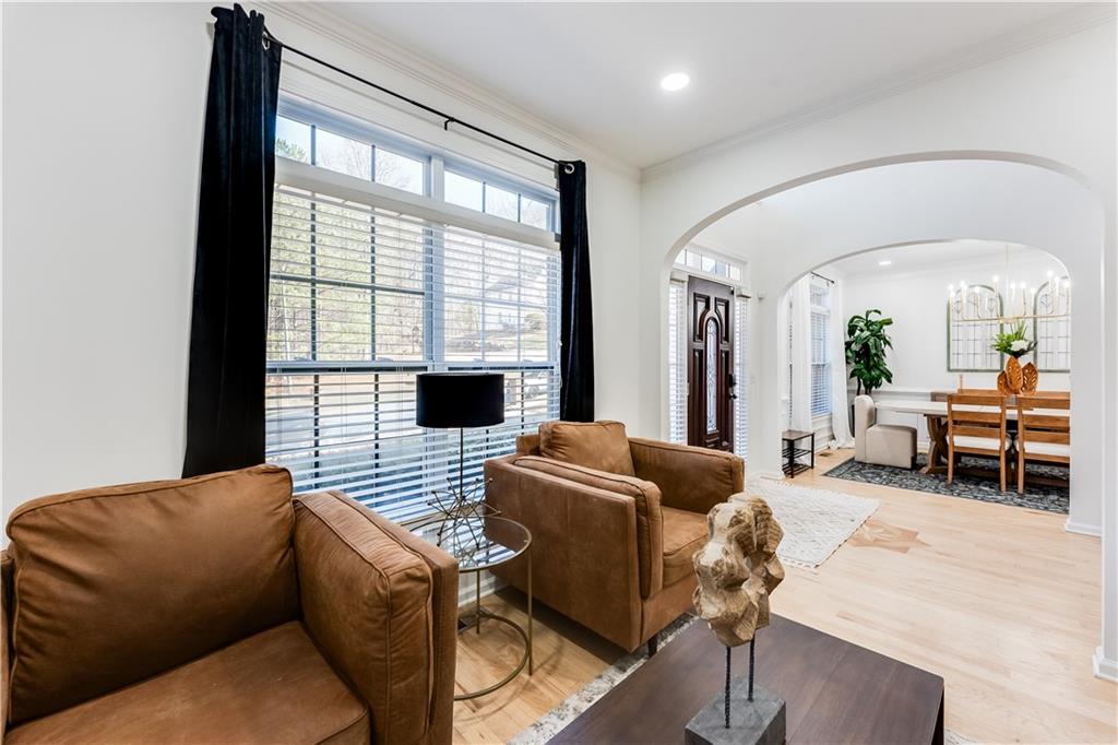 3135 Esplanade Circle Southwest Atlanta, GA 30311 - Photo 5 of 69 a living room with furniture fireplace and large windows