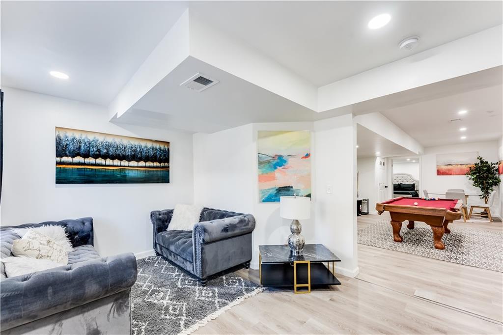 3135 Esplanade Circle Southwest Atlanta, GA 30311 - Photo 64 of 69 a living room with furniture and a wooden floor