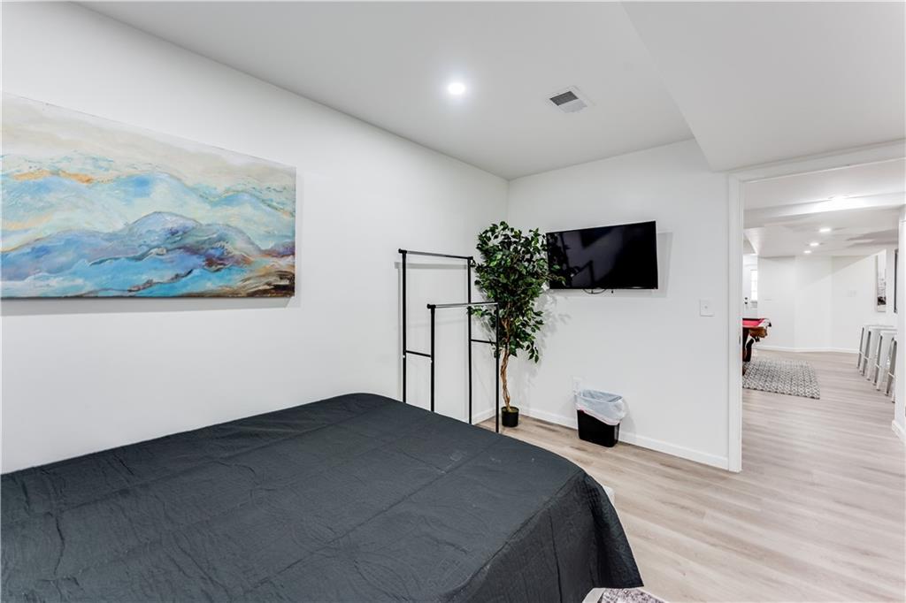 3135 Esplanade Circle Southwest Atlanta, GA 30311 - Photo 66 of 69 a bedroom with a bed and a flat screen tv