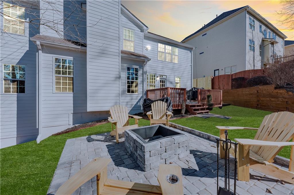 3135 Esplanade Circle Southwest Atlanta, GA 30311 - Photo 68 of 69 a view of a house with backyard sitting area and furniture