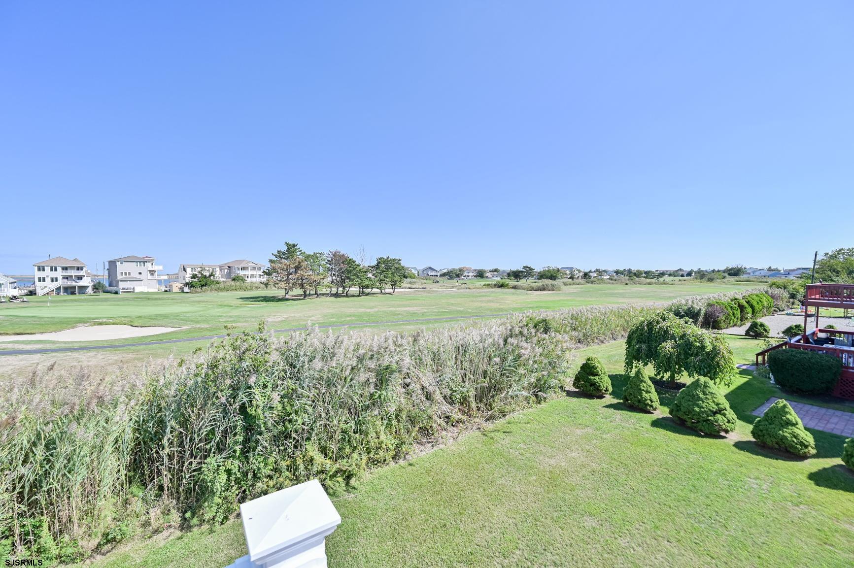 221 Hagen Road Brigantine, NJ 08203 - Photo 24 of 32 a view of a lake with a big yard