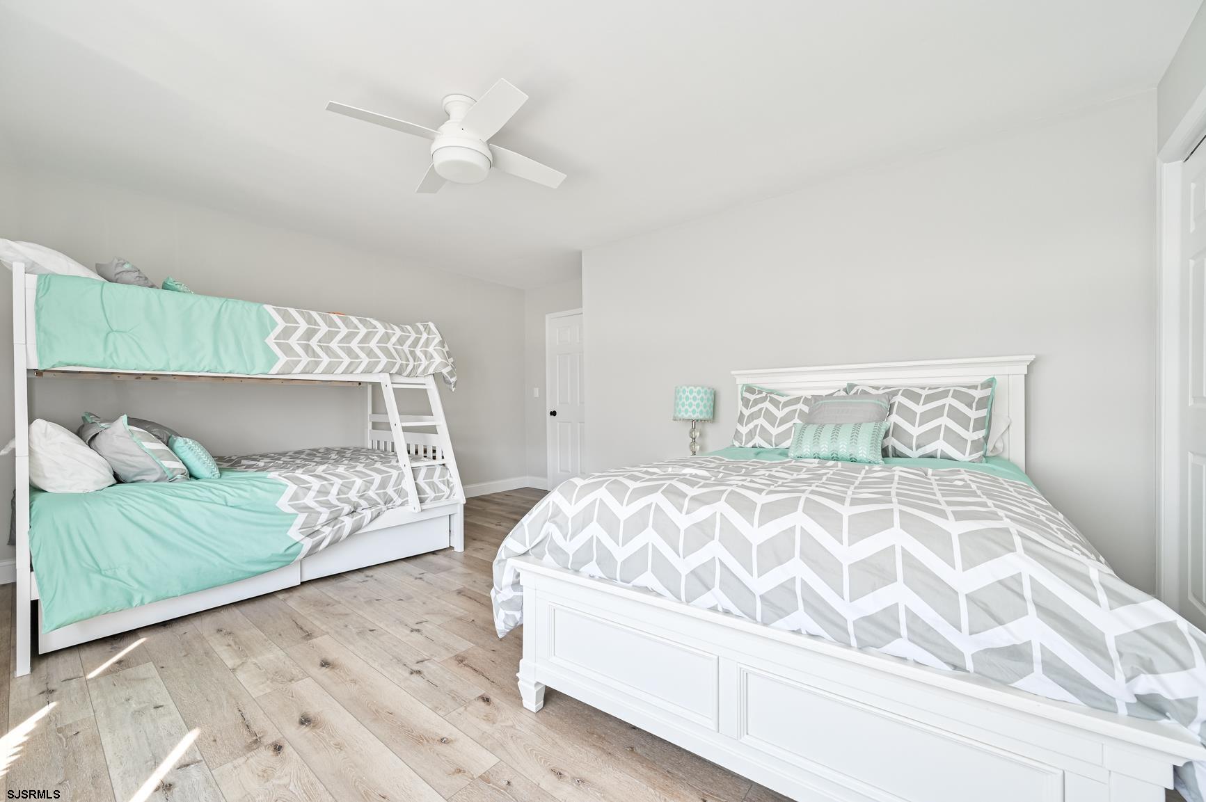 221 Hagen Road Brigantine, NJ 08203 - Photo 27 of 32 a bed sitting in a bedroom next to a larger window