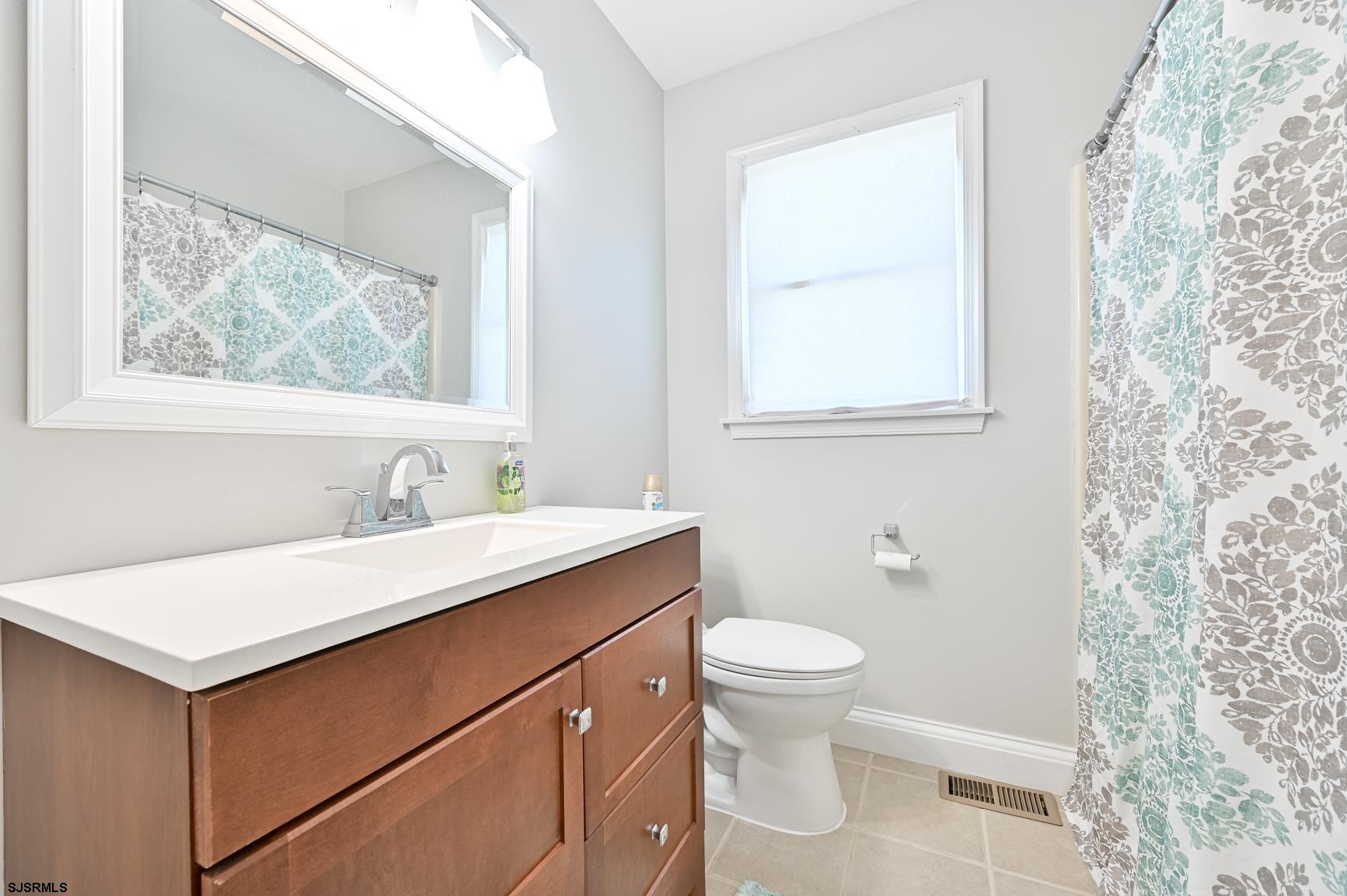 221 Hagen Road Brigantine, NJ 08203 - Photo 28 of 32 a bathroom with a sink and a toilet