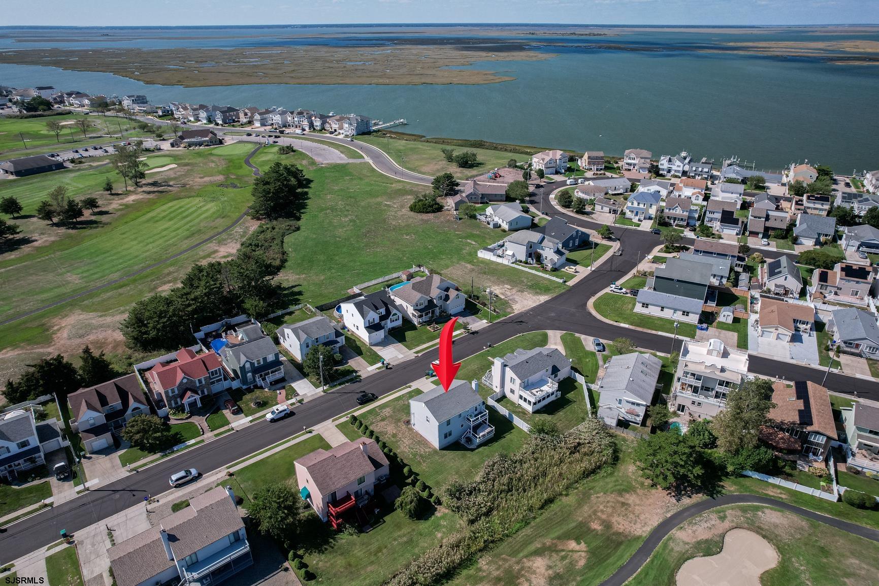 221 Hagen Road Brigantine, NJ 08203 - Photo 31 of 32 an aerial view of a house with a lake view