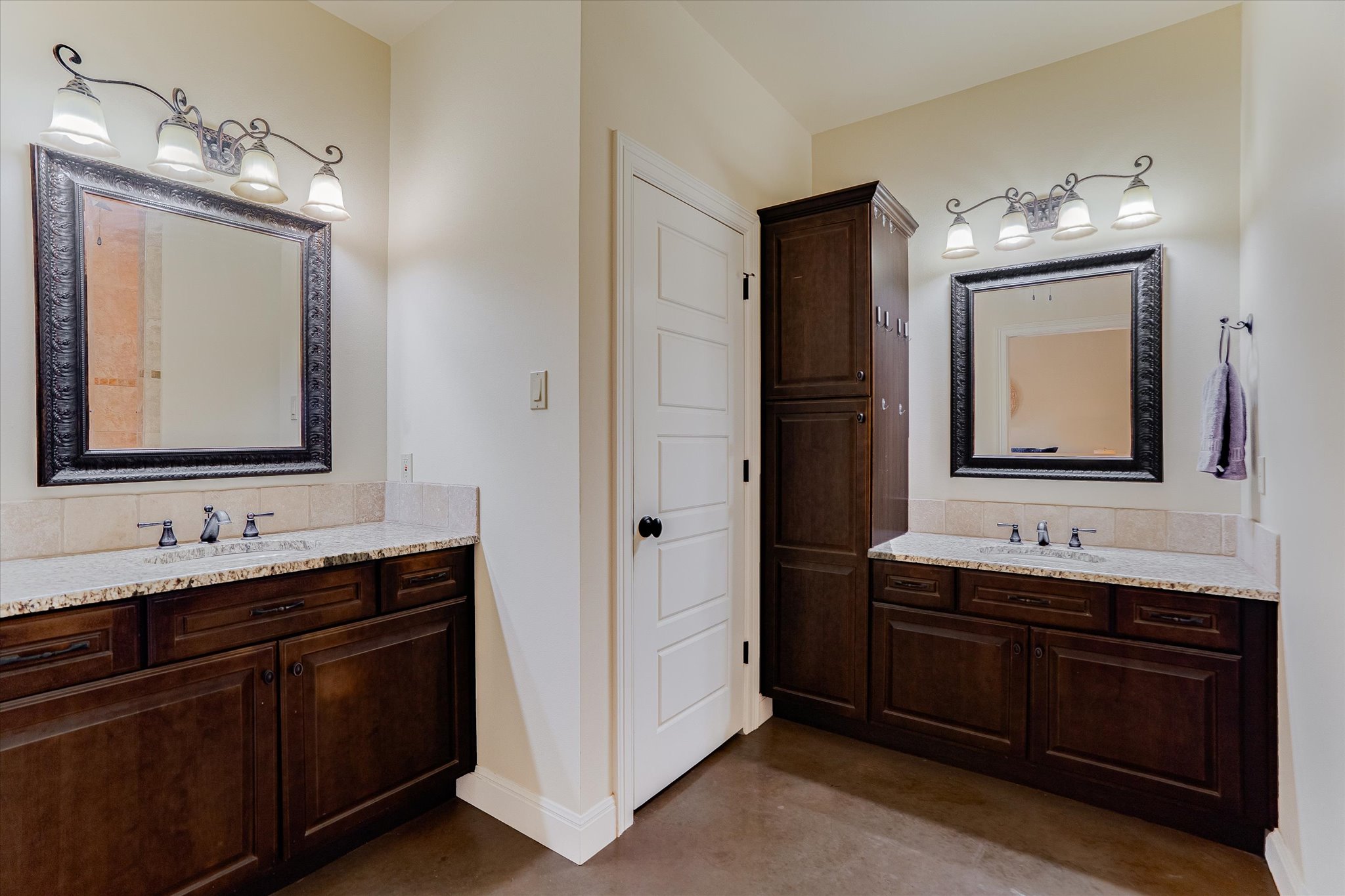 3501 Pursley Road Dripping Springs, TX 78620 - Photo 16 of 38 a bathroom with double vanity sinks and a mirror