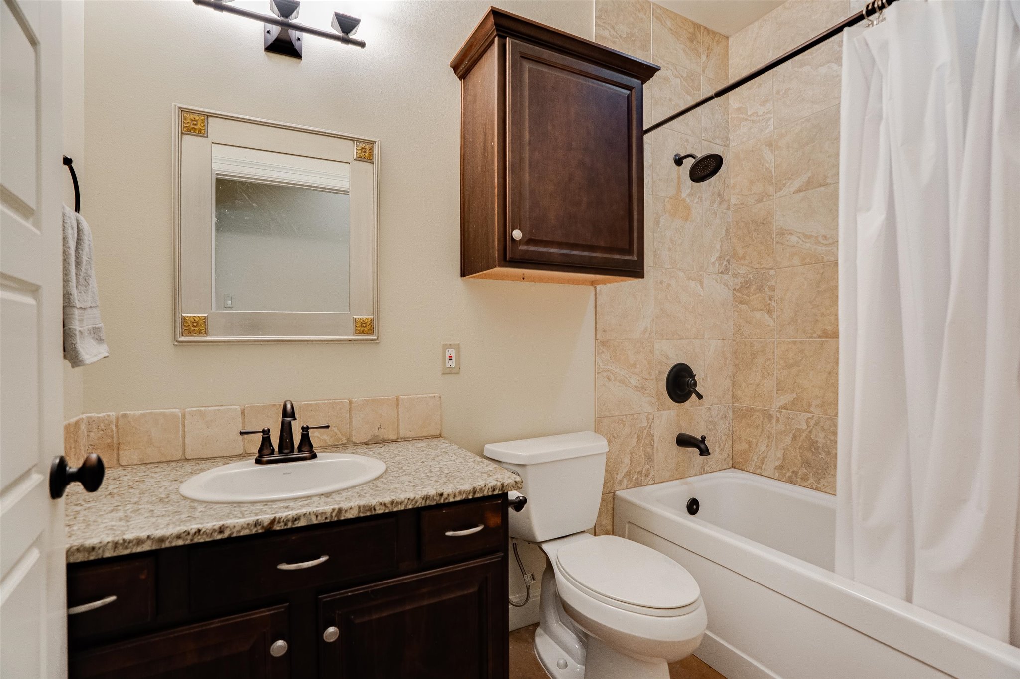 3501 Pursley Road Dripping Springs, TX 78620 - Photo 19 of 38 a bathroom with a granite countertop sink toilet and shower
