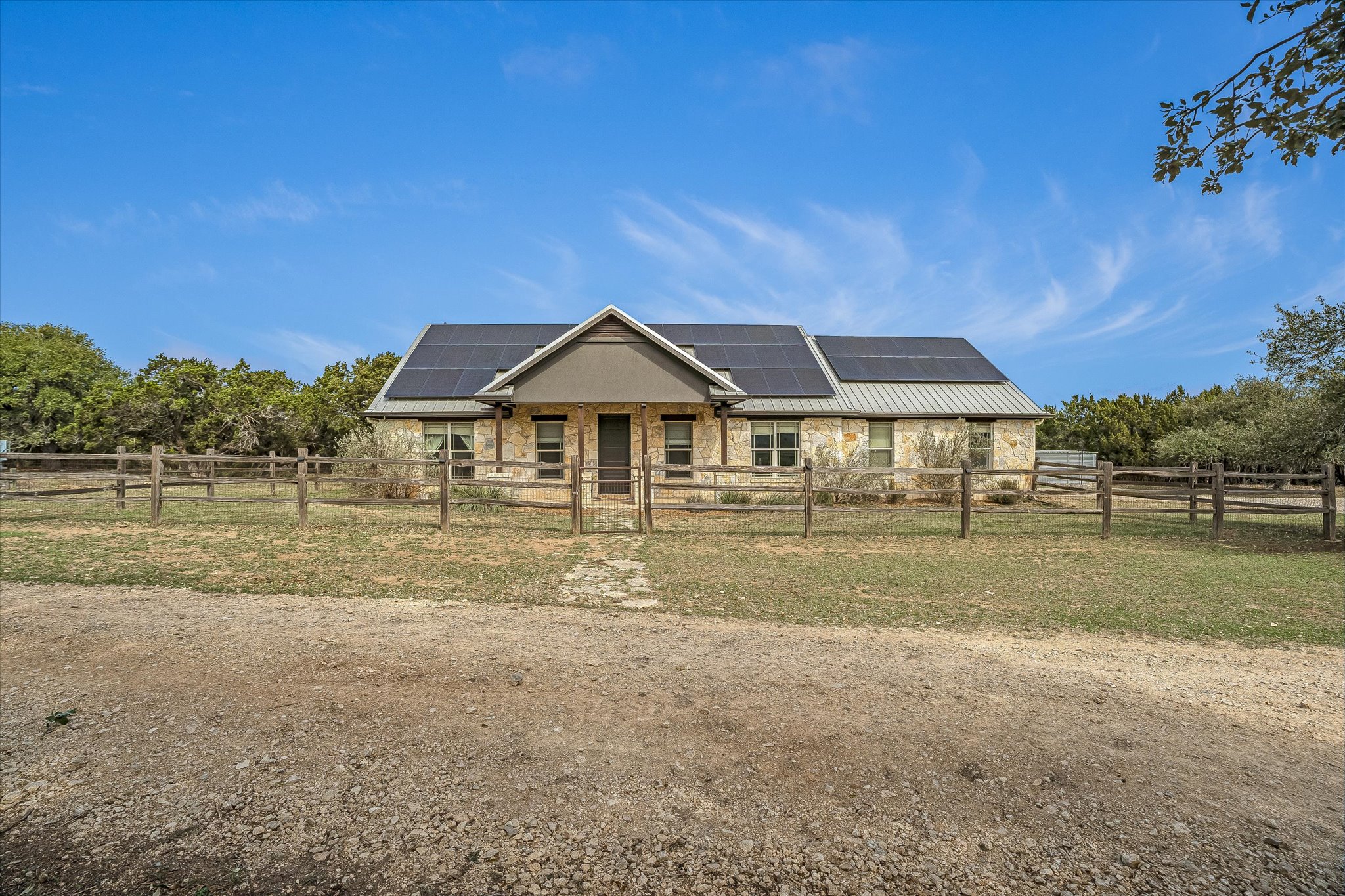 3501 Pursley Road Dripping Springs, TX 78620 - Photo 2 of 38 a front view of a house with a yard