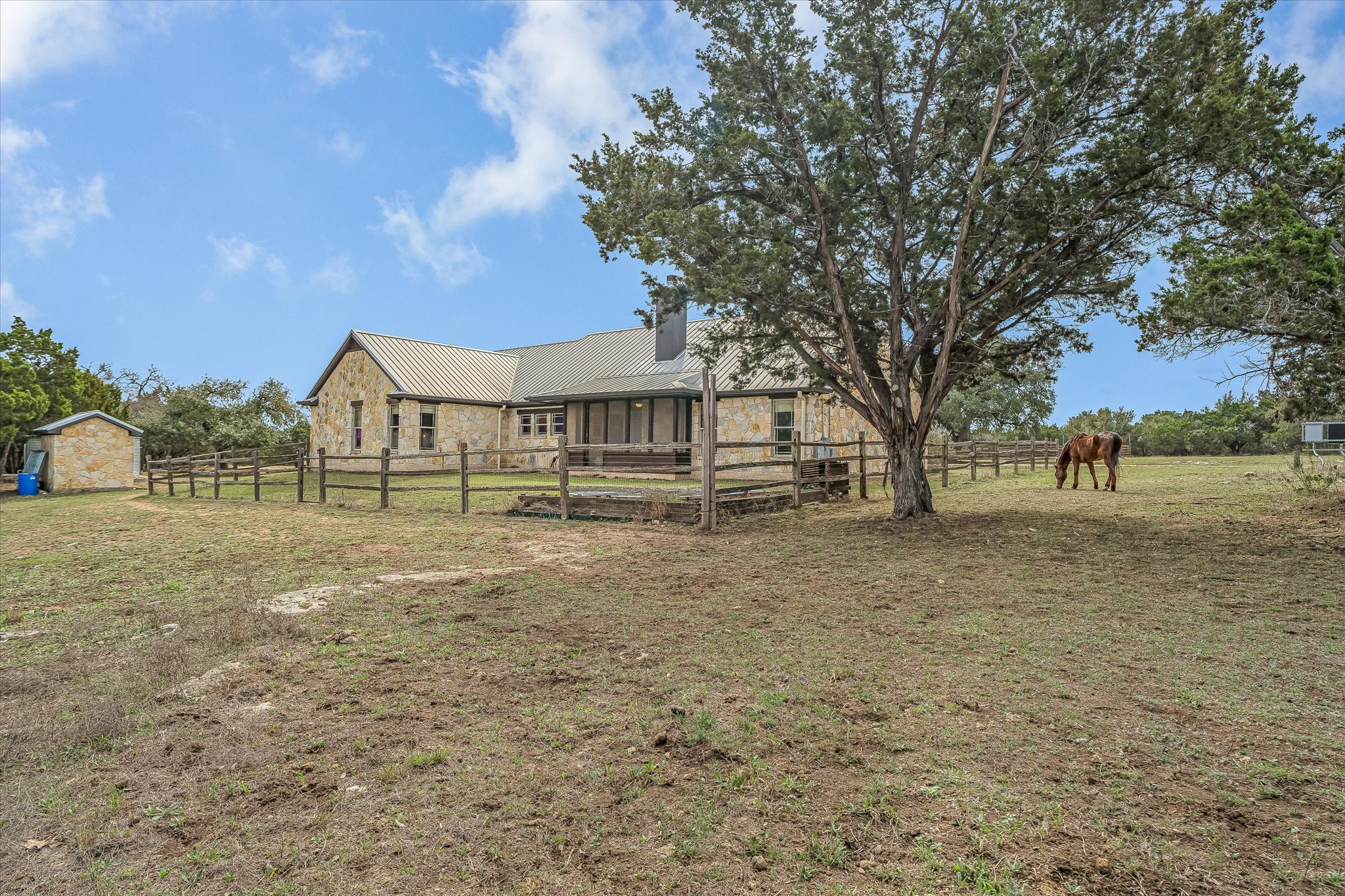 3501 Pursley Road Dripping Springs, TX 78620 - Photo 26 of 38 a view of house with outdoor space and trees