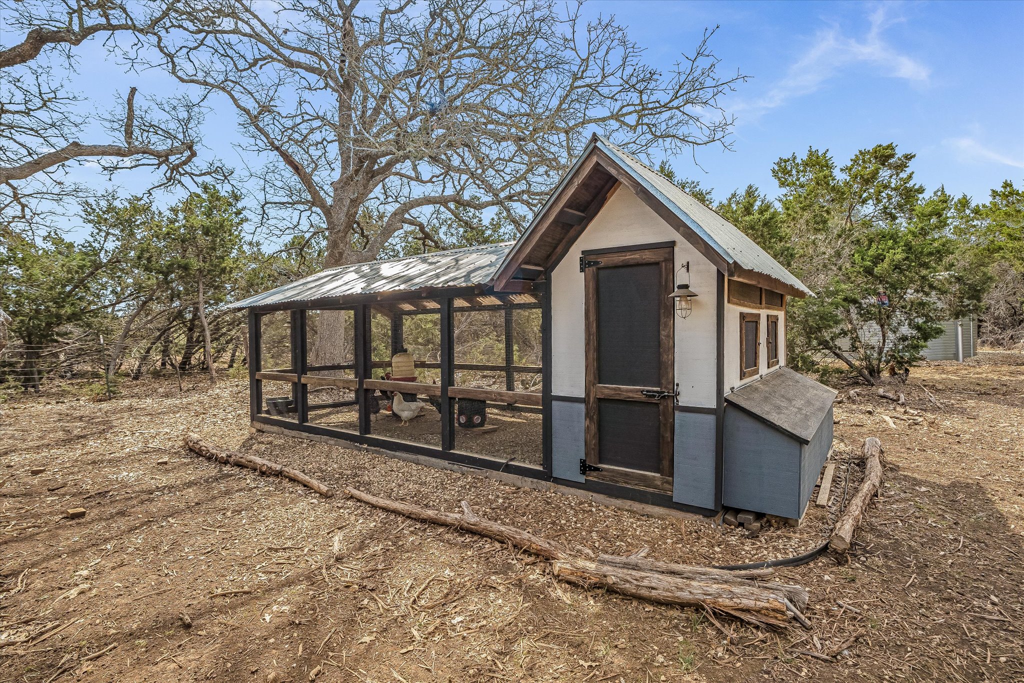 3501 Pursley Road Dripping Springs, TX 78620 - Photo 31 of 38 a view of a house with a yard and wooden fence