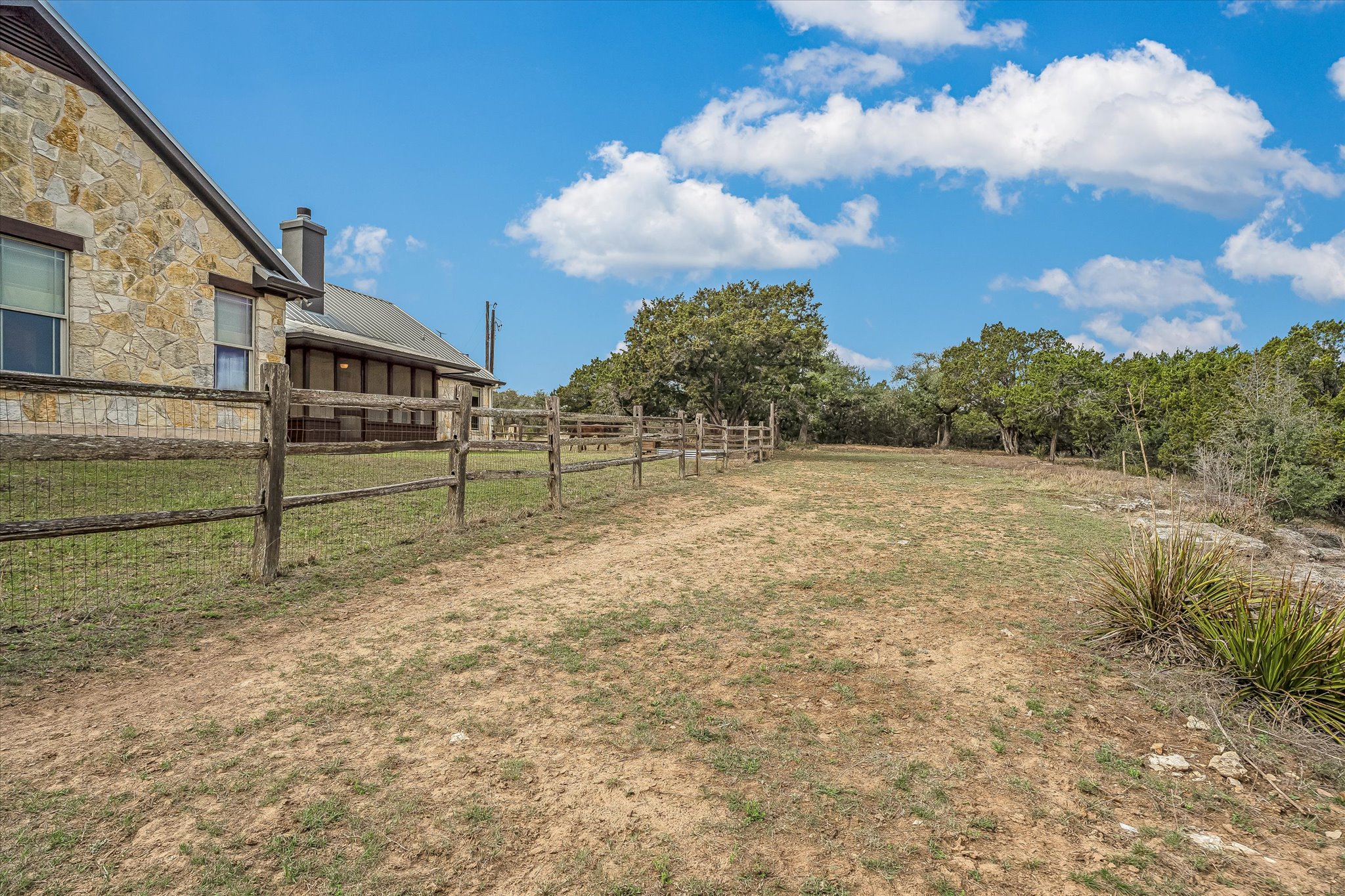3501 Pursley Road Dripping Springs, TX 78620 - Photo 37 of 38 a view of a house with a backyard