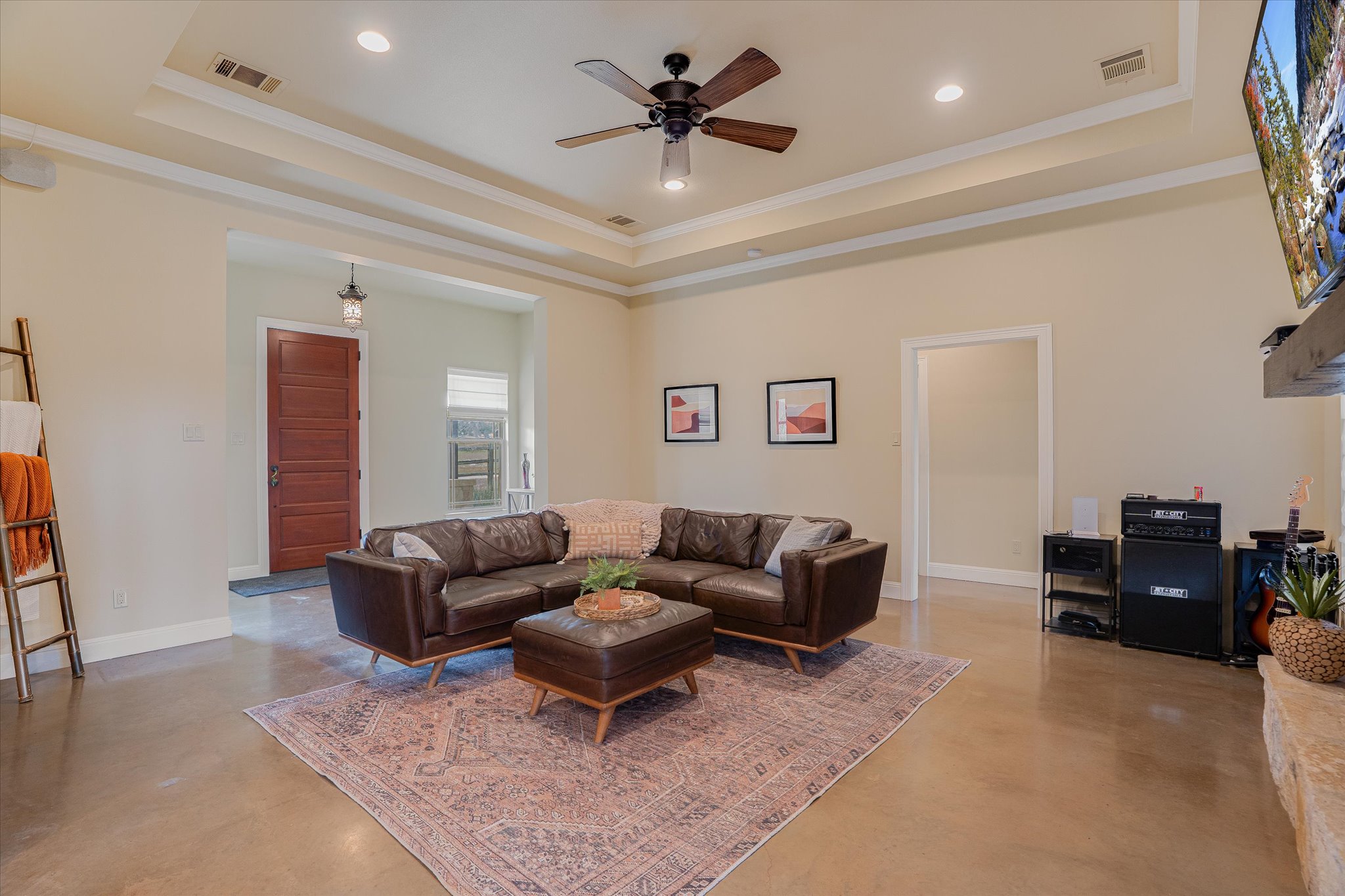 3501 Pursley Road Dripping Springs, TX 78620 - Photo 4 of 38 a living room with furniture a rug and a chandelier