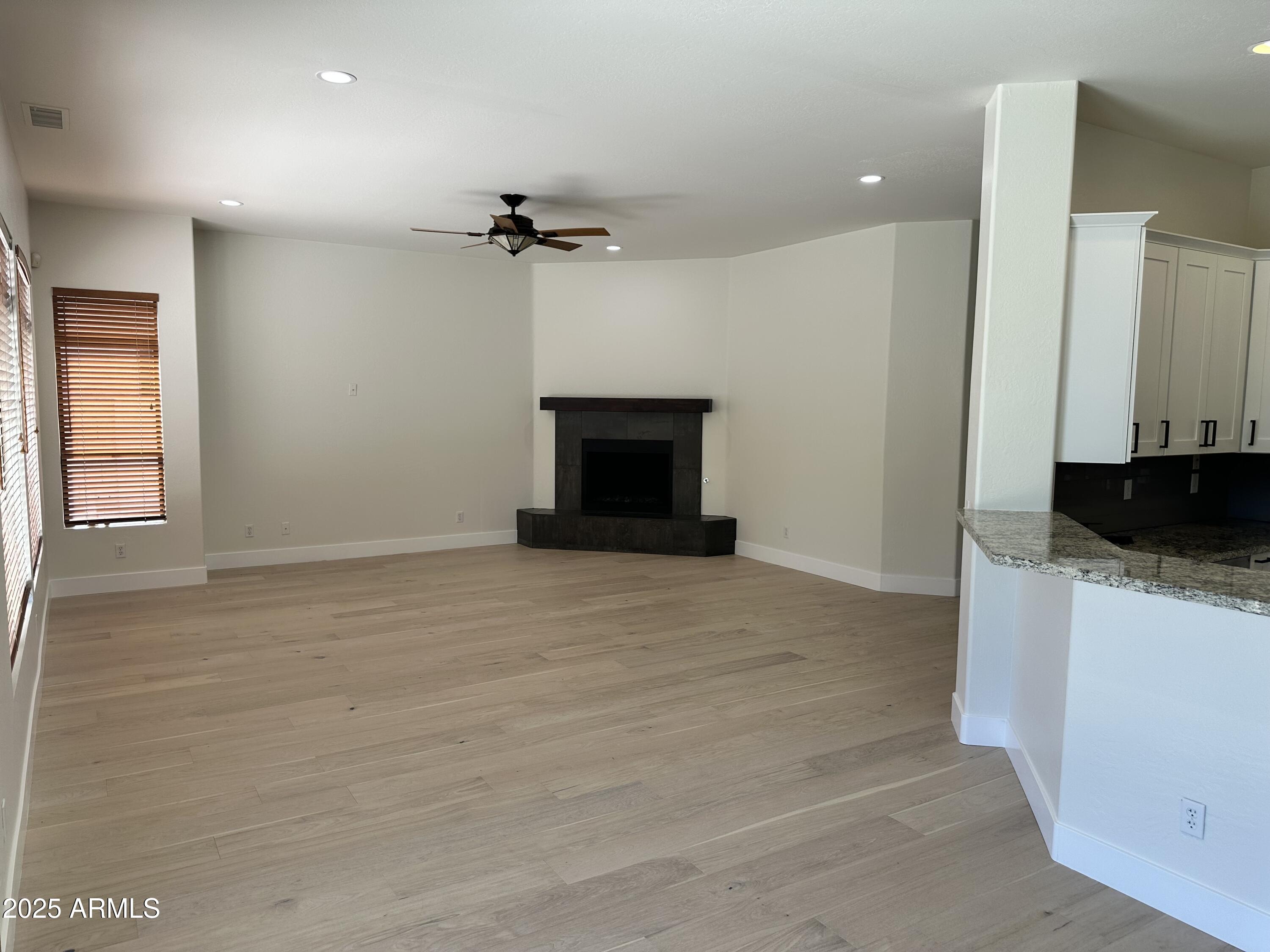 4303 East Hamblin Drive Phoenix, AZ 85050 - Photo 4 of 16 a view of a livingroom with a fireplace