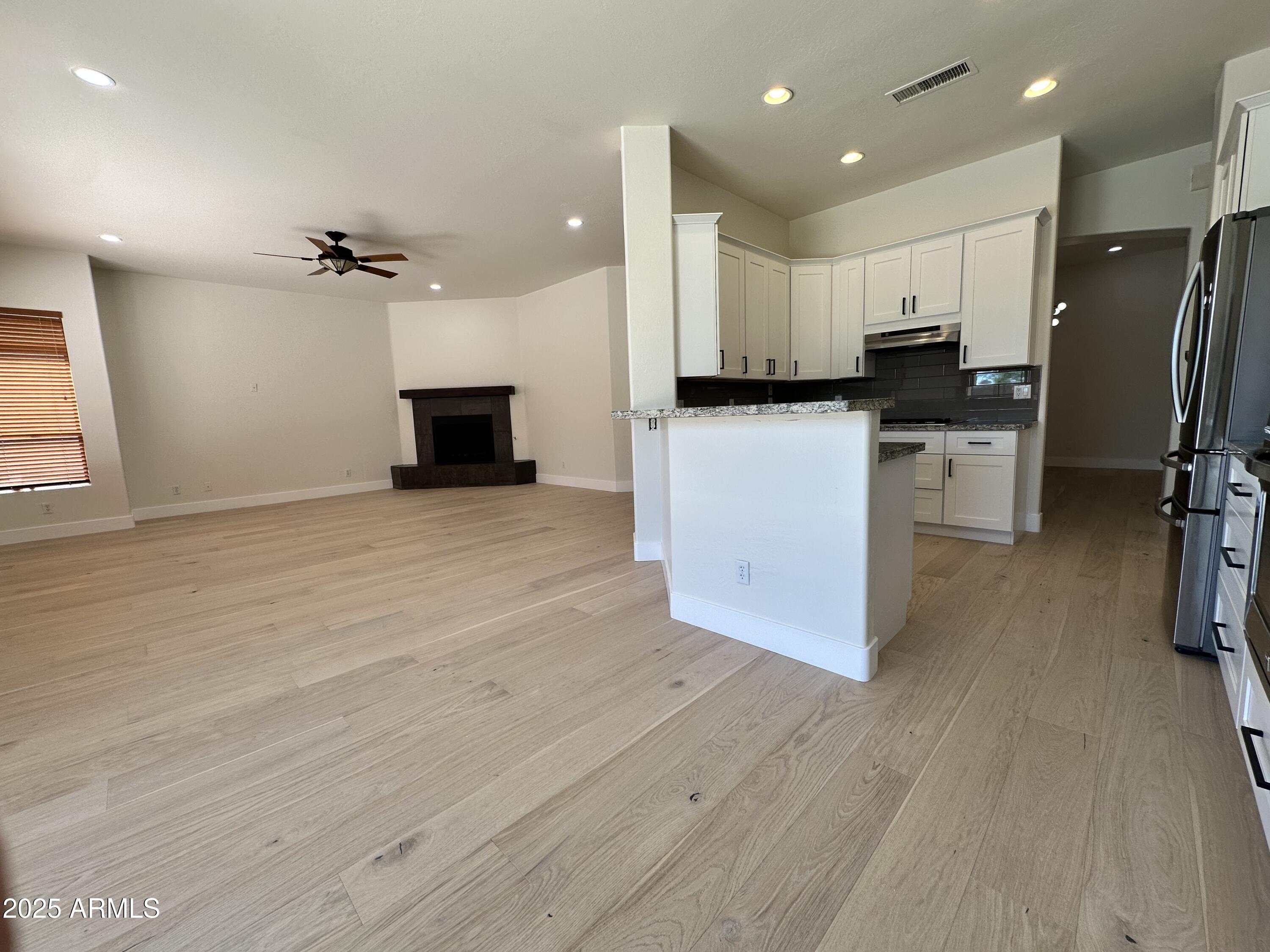 4303 East Hamblin Drive Phoenix, AZ 85050 - Photo 5 of 16 a view of kitchen with stainless steel appliances refrigerator stove microwave and cabinets