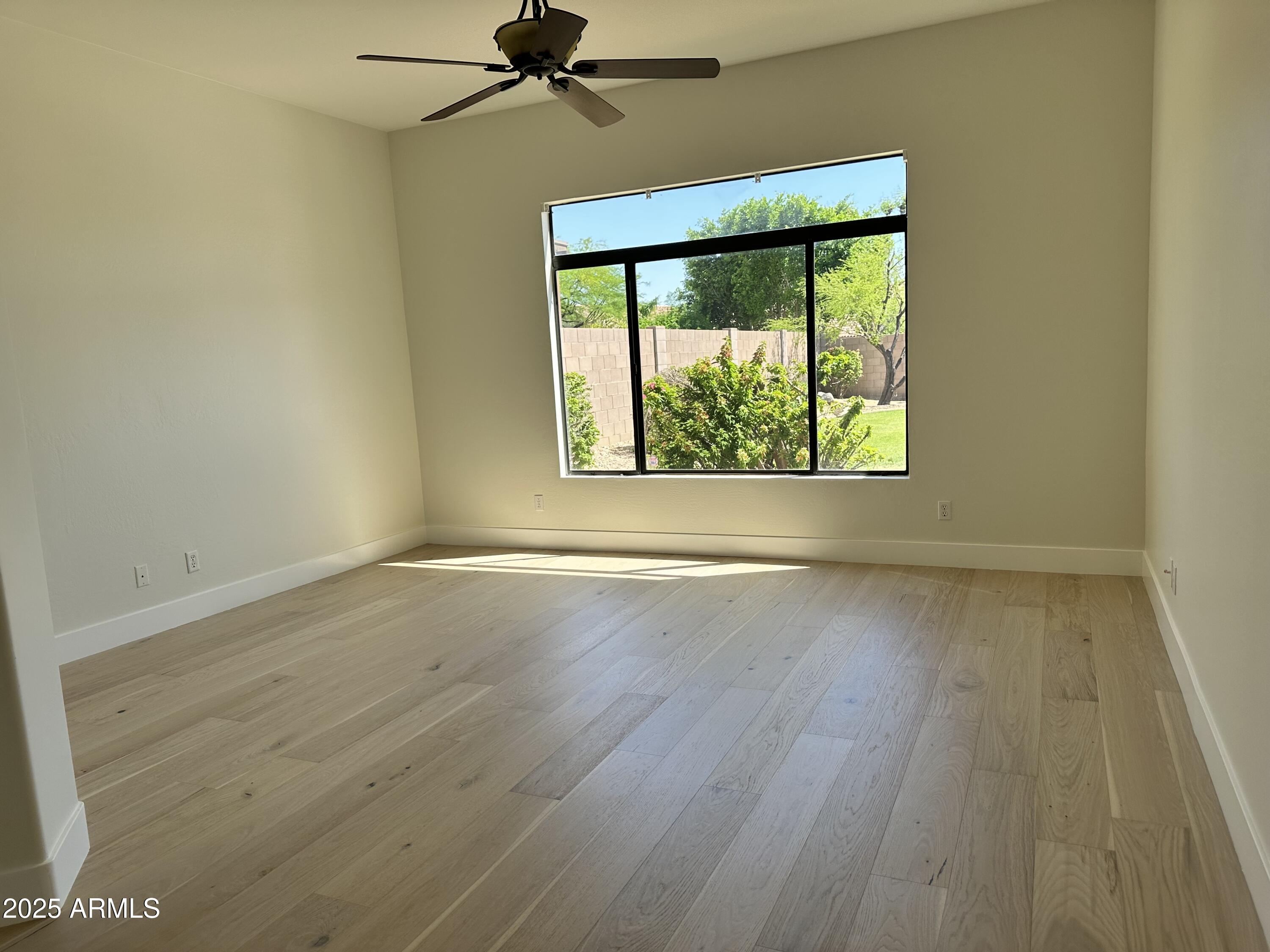 4303 East Hamblin Drive Phoenix, AZ 85050 - Photo 10 of 16 an empty room with a window