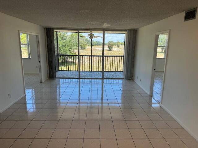 5280 Northwest 2nd Avenue, Unit 213 Boca Raton, FL 33487 - Photo 1 of 17 a view of an empty room and window