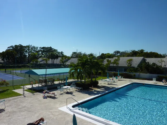 a view of a swimming pool with a patio
