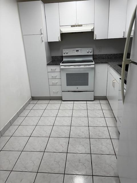 5280 Northwest 2nd Avenue, Unit 213 Boca Raton, FL 33487 - Photo 2 of 17 a kitchen with a sink a stove and cabinets