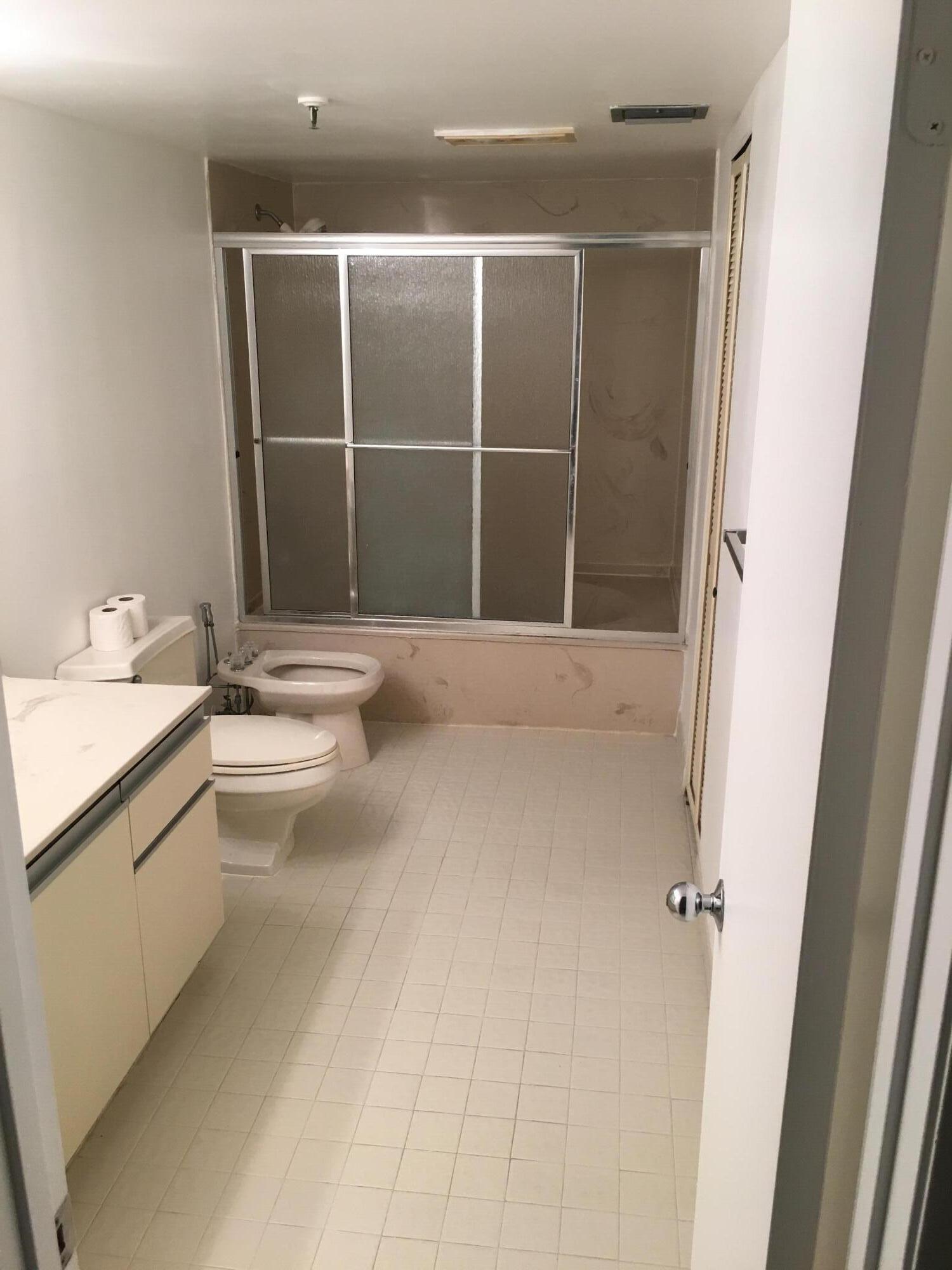 5280 Northwest 2nd Avenue, Unit 213 Boca Raton, FL 33487 - Photo 6 of 17 a view of walk in closet with empty racks