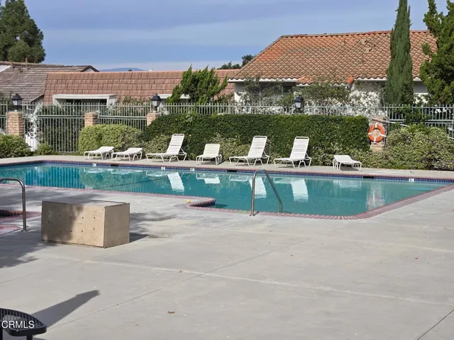 a view of a water fountain and a terrace