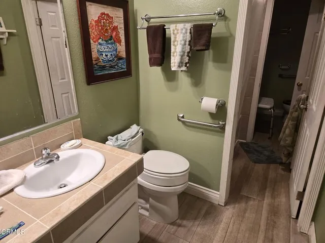 a bathroom with a sink and toilet