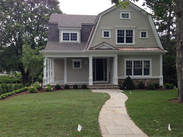 12 Willow Road Wellesley, MA 02482 - Photo 1 of 30 a front view of a house with a garden