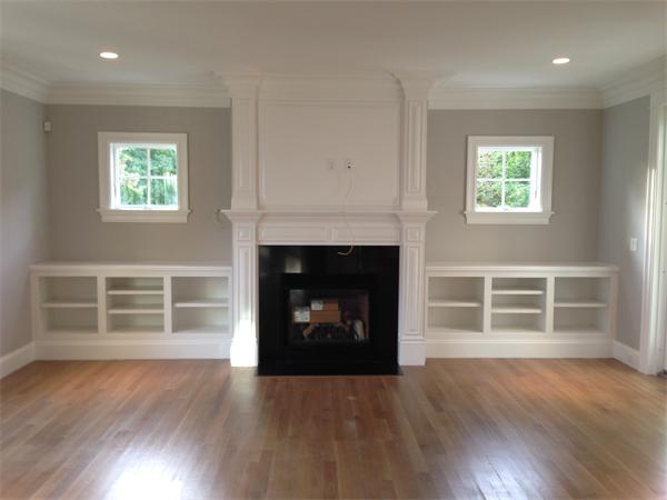 12 Willow Road Wellesley, MA 02482 - Photo 13 of 30 a living room with a fireplace and wooden floor