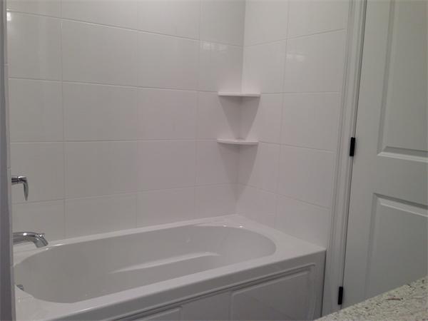 12 Willow Road Wellesley, MA 02482 - Photo 23 of 30 a close view of a bathtub in bathroom