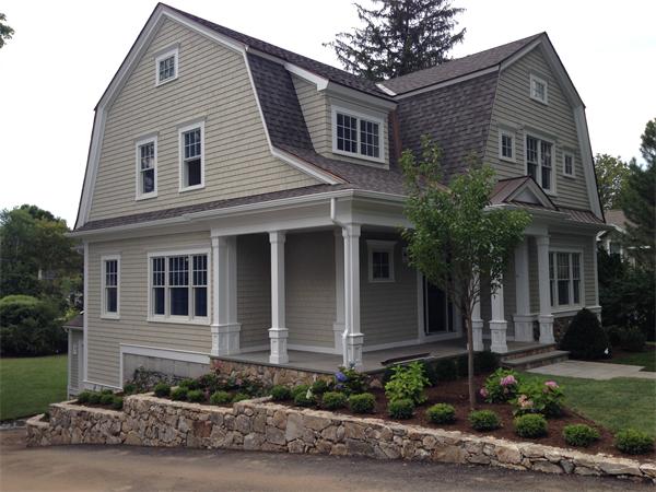 12 Willow Road Wellesley, MA 02482 - Photo 5 of 30 a front view of a house with plants