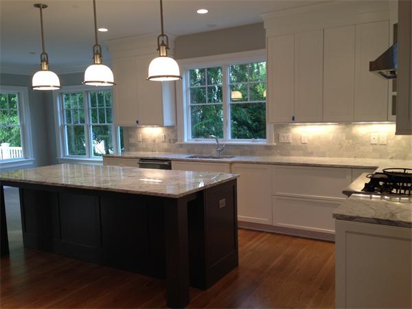 12 Willow Road Wellesley, MA 02482 - Photo 10 of 30 a kitchen with kitchen island a counter space a large window and appliances