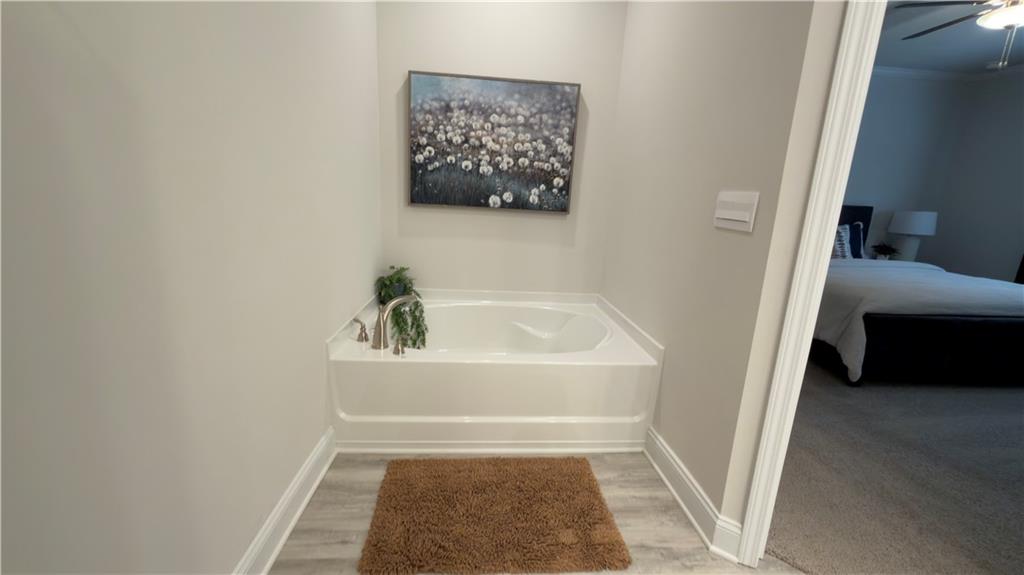 620 Bald Ridge Circle Demorest, GA 30535 - Photo 18 of 43 a bathroom with a tub and a shower