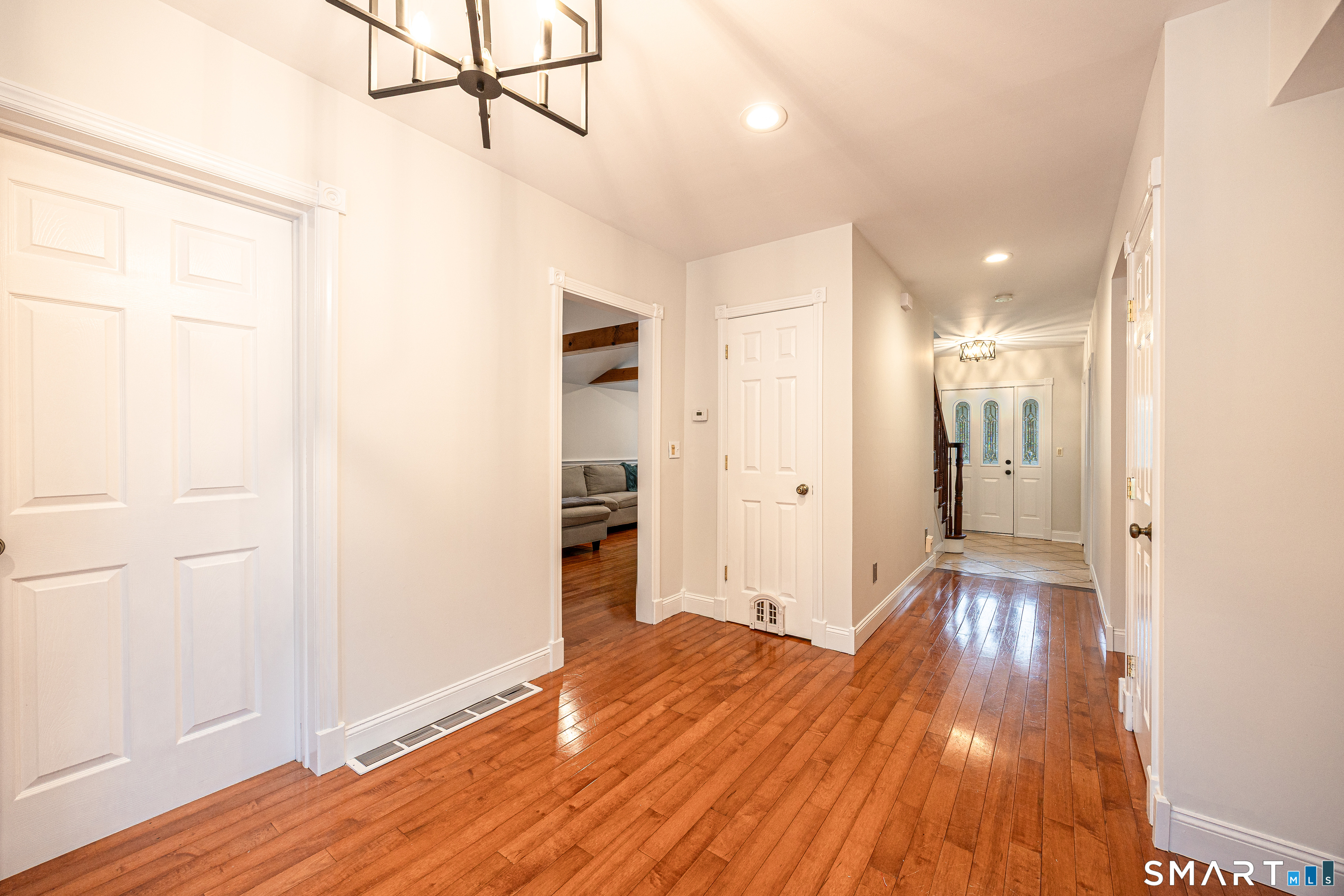 148 Cross Hill Road Monroe, CT 06468 - Photo 10 of 36 a view of a hallway with wooden floor
