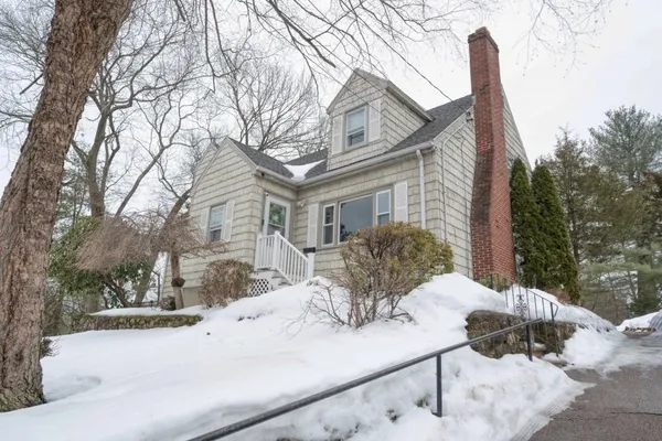 a view of a house with a snow in the yard