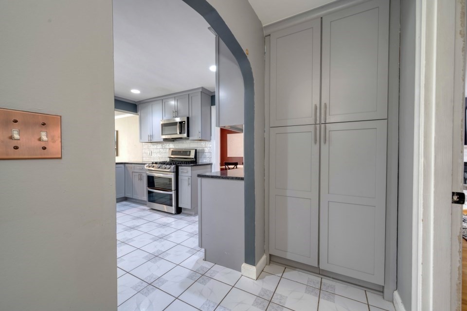 193 Vincent Road Dedham, MA 02026 - Photo 11 of 42 a kitchen with stainless steel appliances granite countertop a refrigerator and a sink