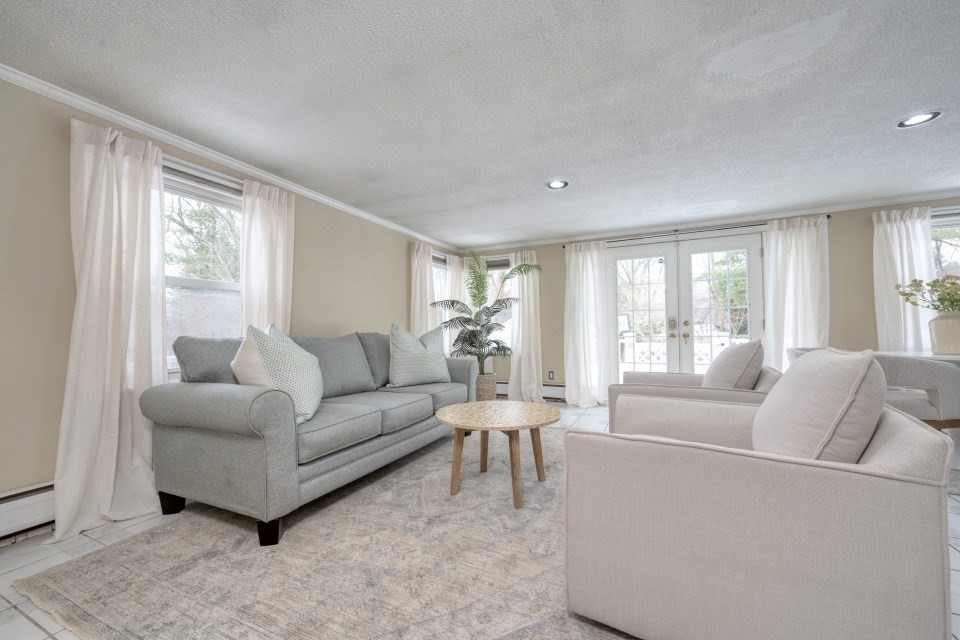 193 Vincent Road Dedham, MA 02026 - Photo 17 of 42 a living room with furniture and a large window