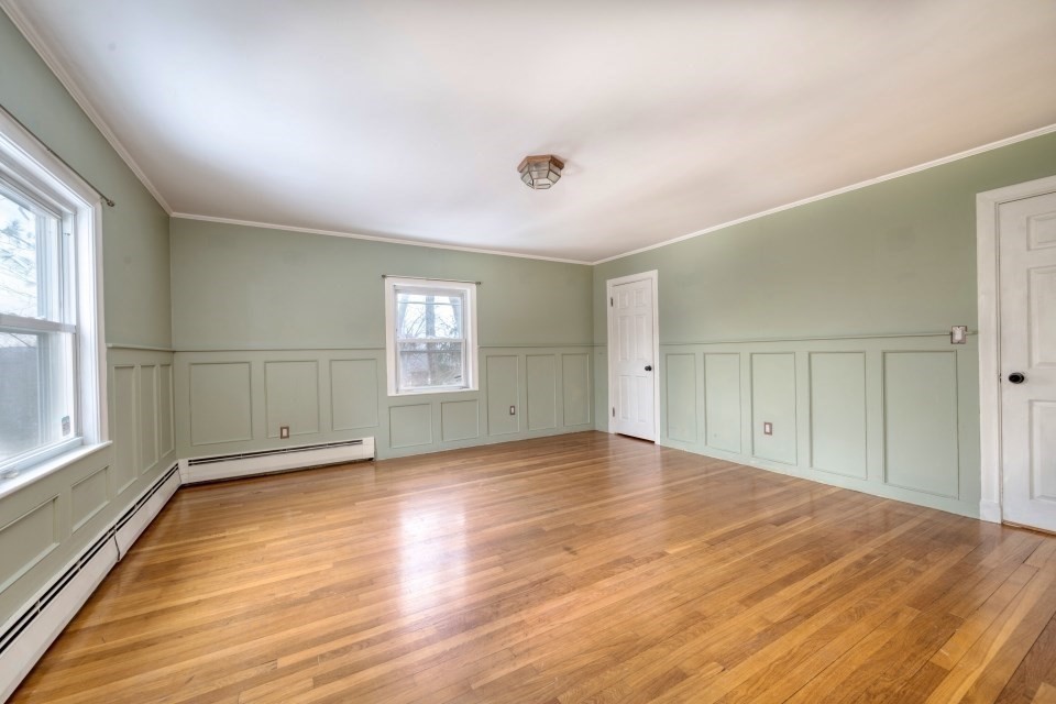 193 Vincent Road Dedham, MA 02026 - Photo 24 of 42 an empty room with wooden floor and windows