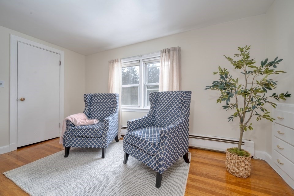 193 Vincent Road Dedham, MA 02026 - Photo 29 of 42 a living room with furniture and wooden floor