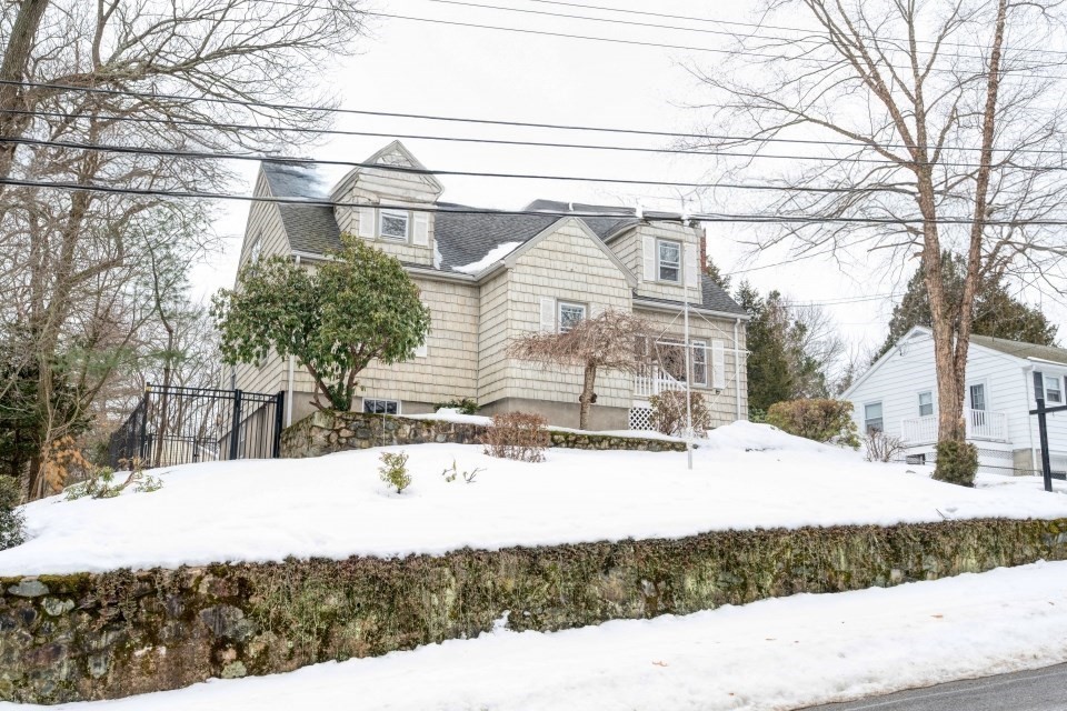 193 Vincent Road Dedham, MA 02026 - Photo 3 of 42 a view of a house with snow on the road