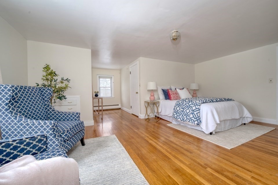 193 Vincent Road Dedham, MA 02026 - Photo 31 of 42 a bedroom with a large bed and a couch